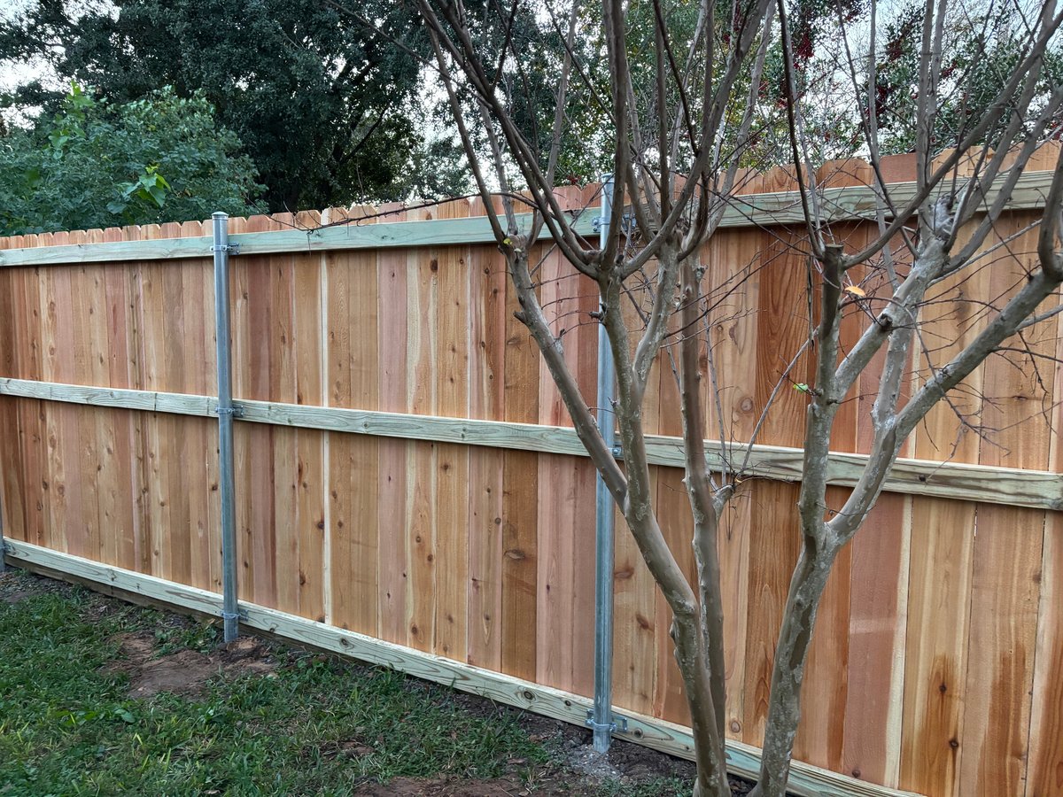Cedar fence installation with metal posts