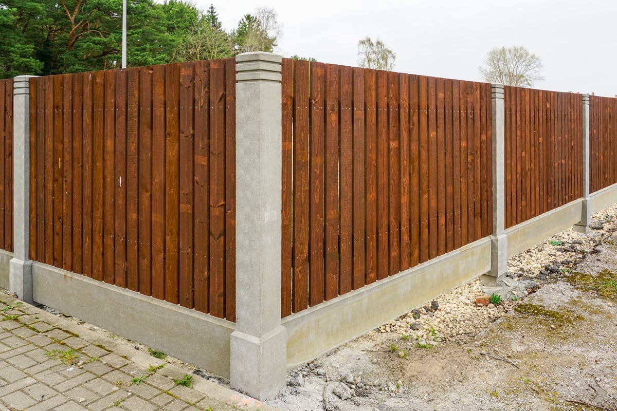 New fence with concrete posts and wood planks