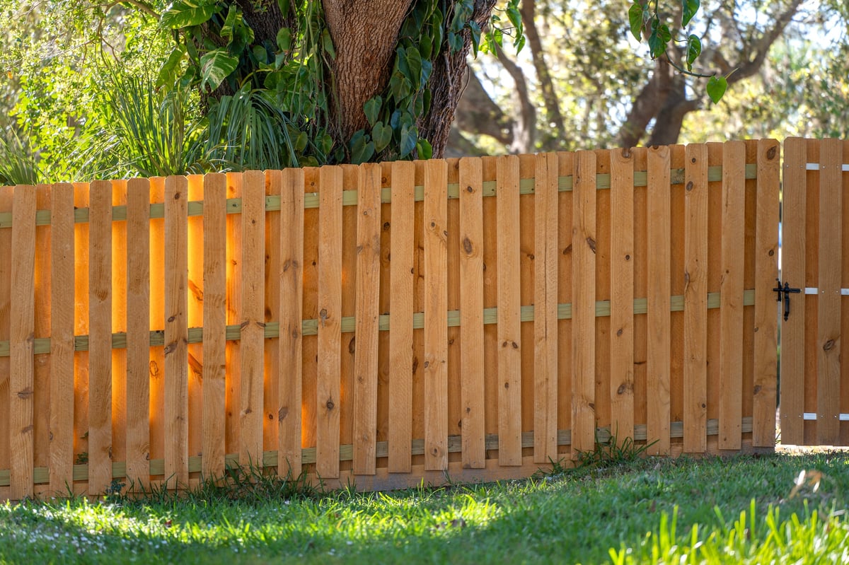 Professional wood privacy fence installation in Metro Atlanta backyard